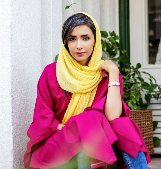 woman in purple long sleeve shirt and yellow hijab